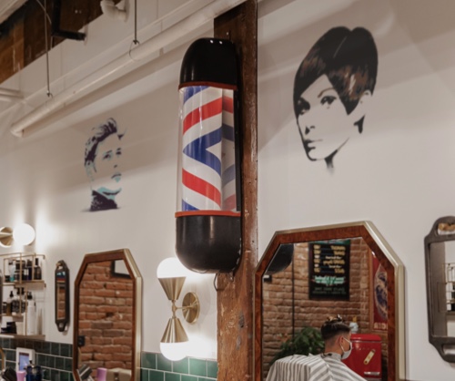 Hairstyle stencils decorate barber shop chair stations